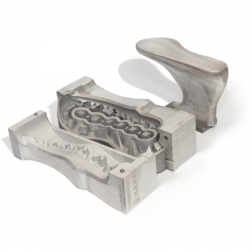 Open mold cavity showing intricate tread pattern